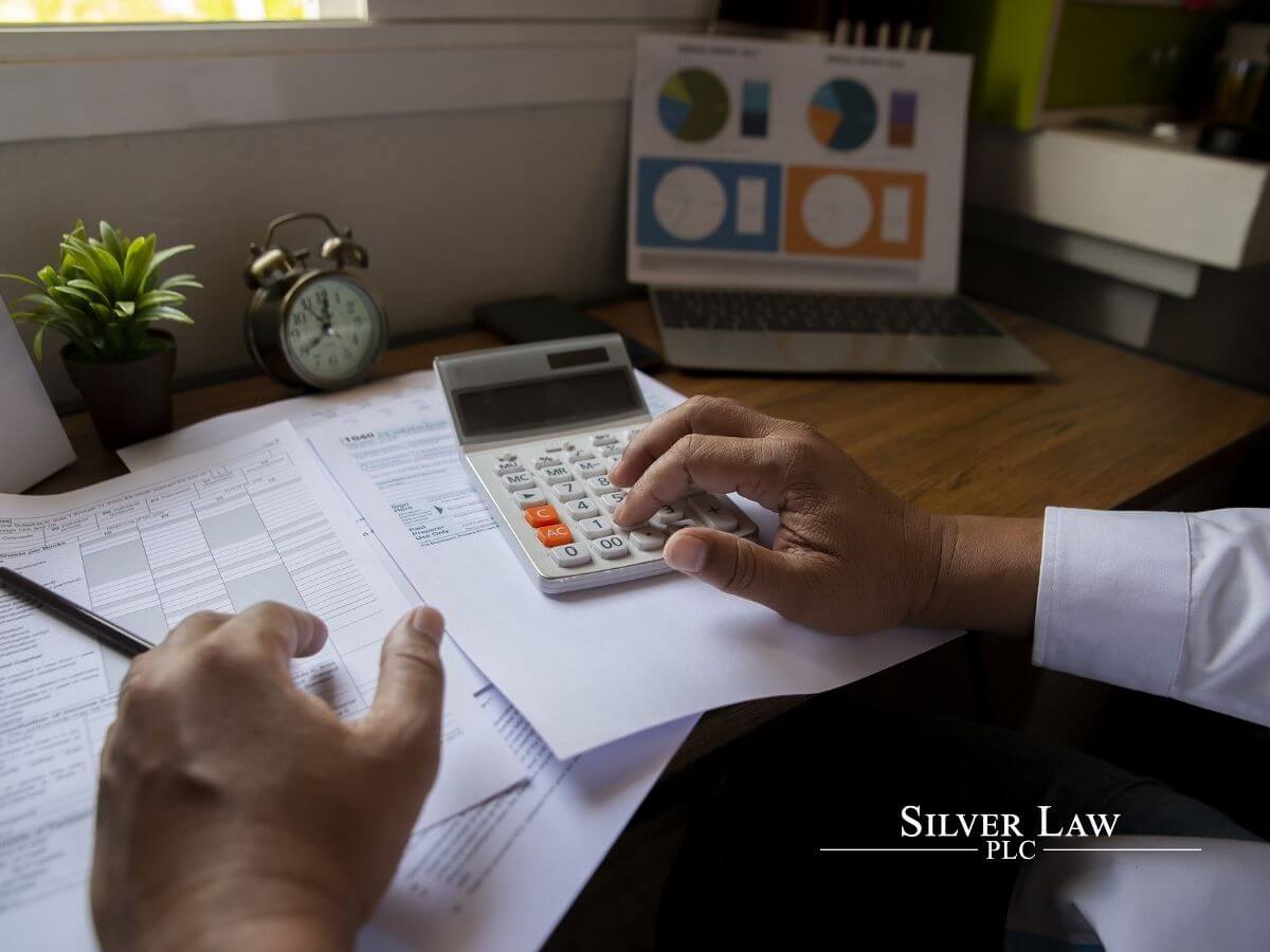 business man calculating annual tax