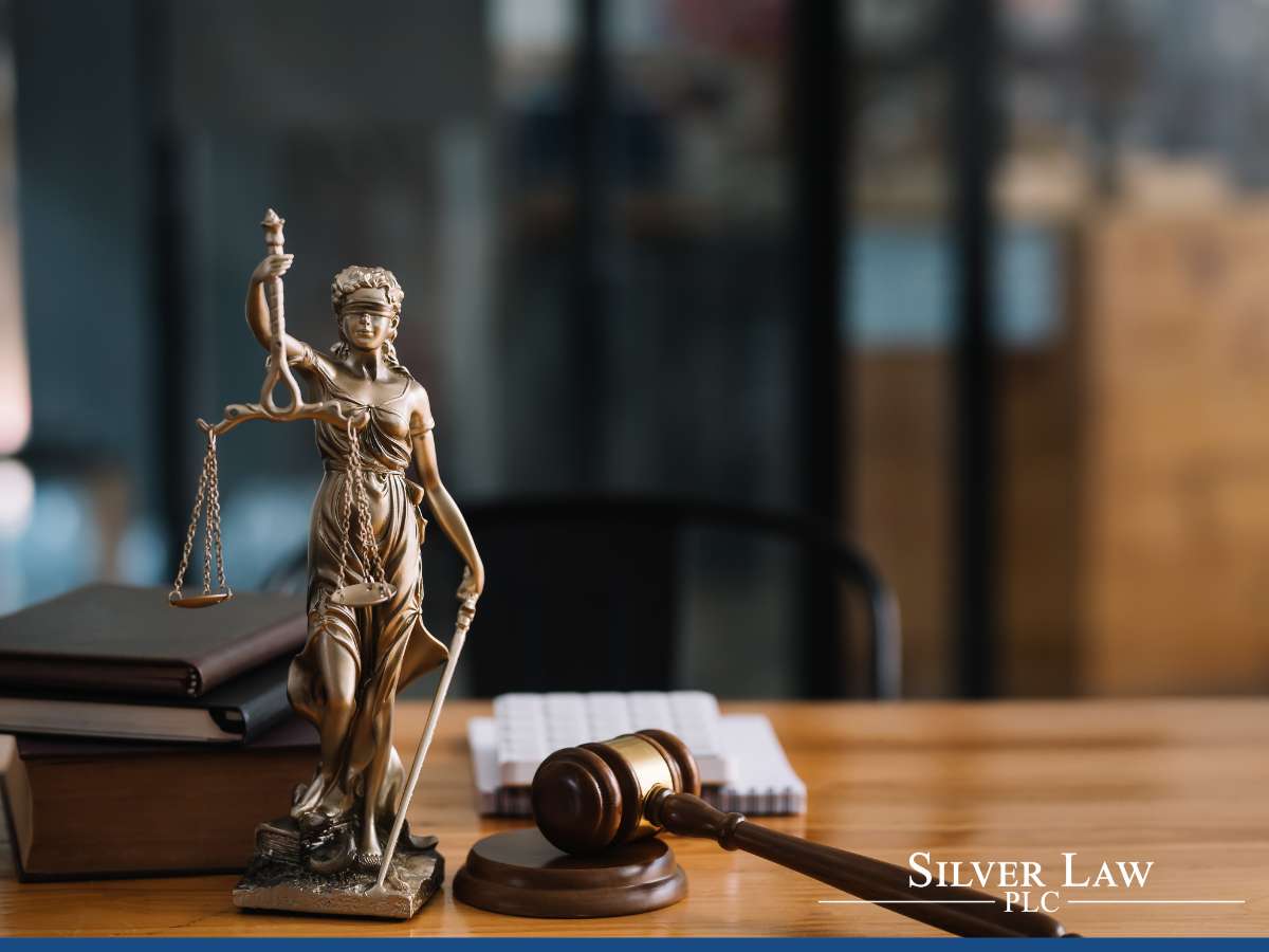 Lady Justice statue with scales, representing Silver Law PLC's legal services amid the IRS crackdown on high-wealth tax evasion