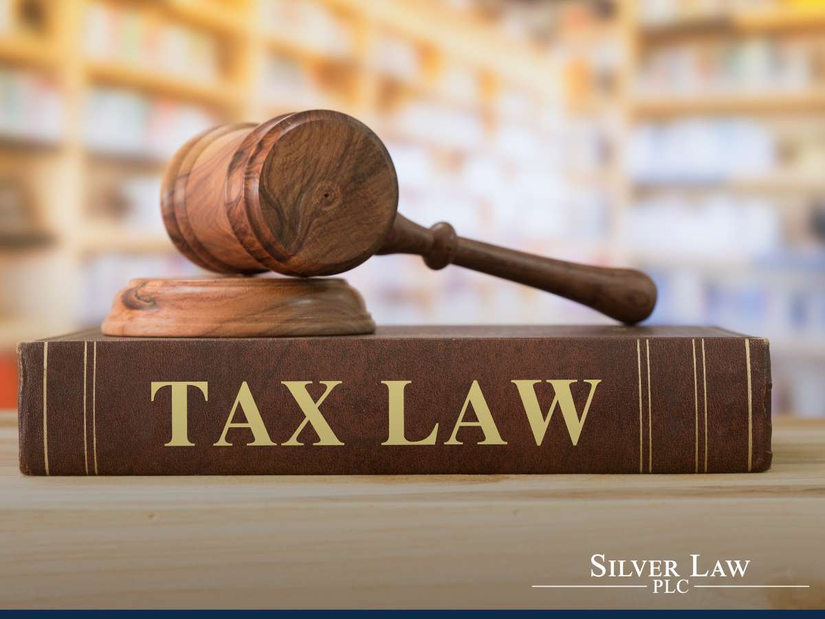 Gavel on a tax law book with, symbolizing legal expertise in COVID Tax Credit Program issues.