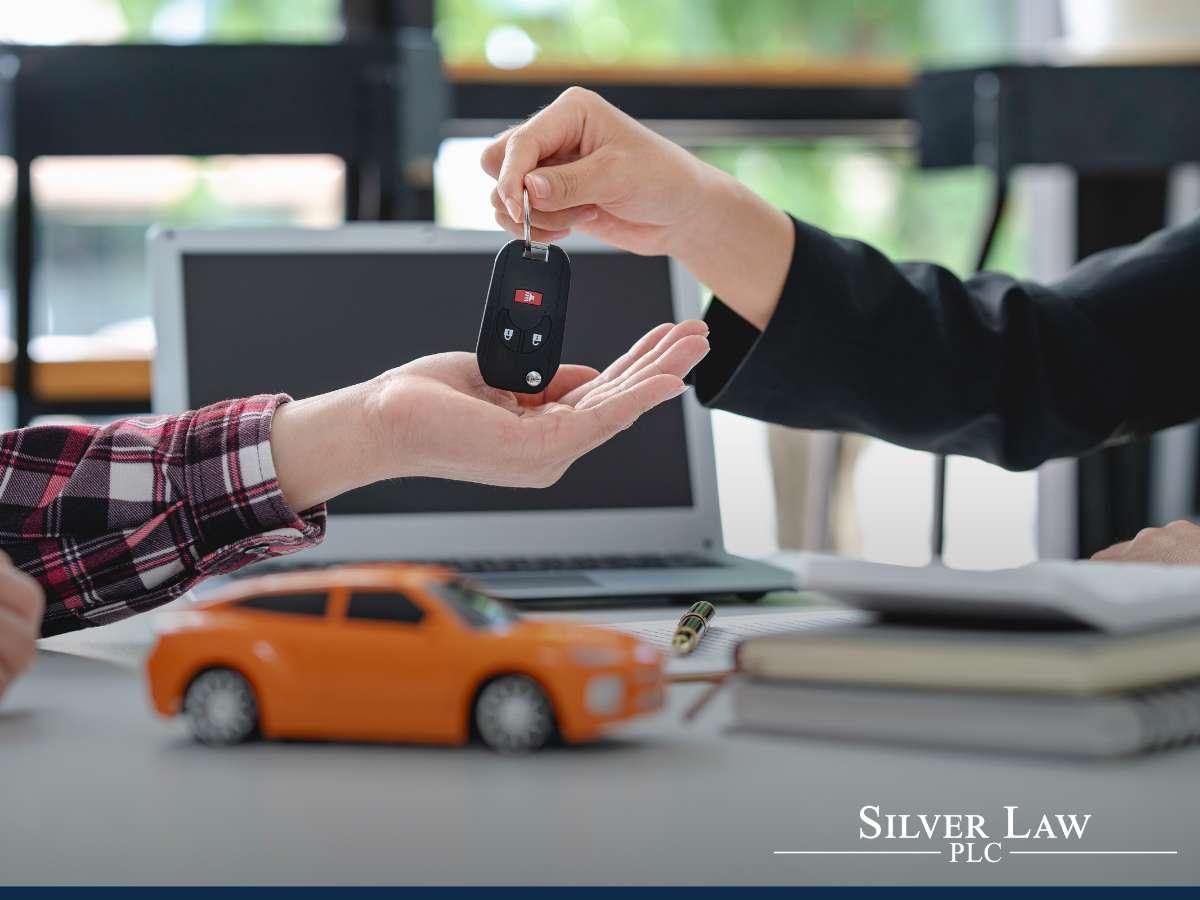 A lawyer explaining the benefits of the Auto Loan Interest Deduction to a client.
